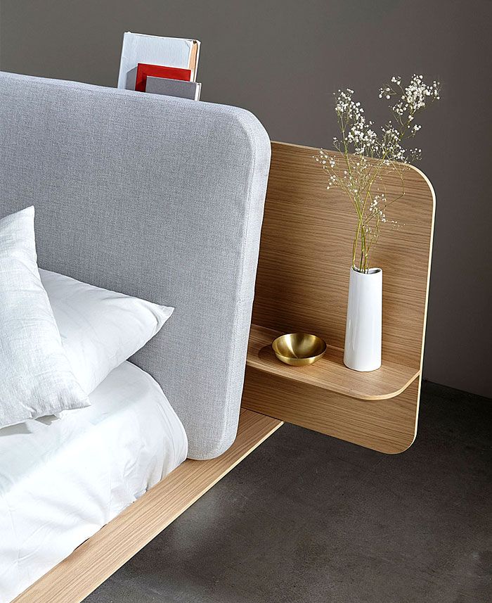 Design inspiration: a rounded timber headboard, integrated bedside table and warm brass details